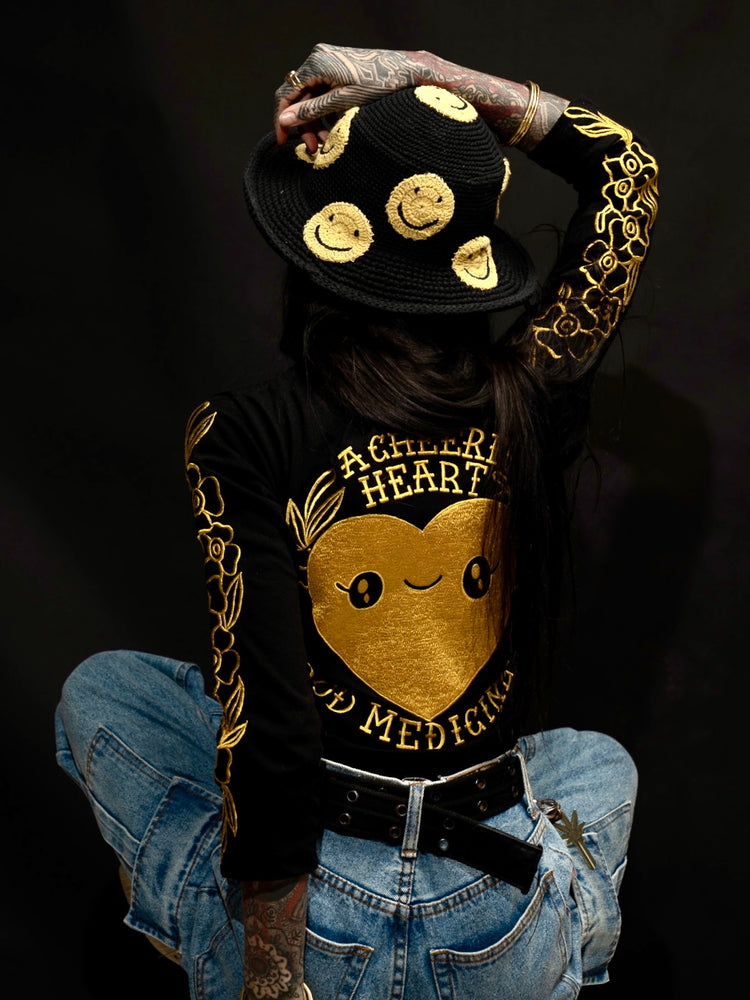 
                  
                    A CHEERFUL HEART IS GOOD MEDICINE - Longsleeve Embroidered Tshirt Black
                  
                